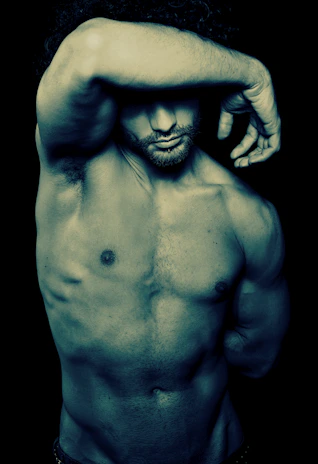 An attractive, muscular man holding a Gatsby Craft Co. illuminated map, framed by geometric art deco elements.