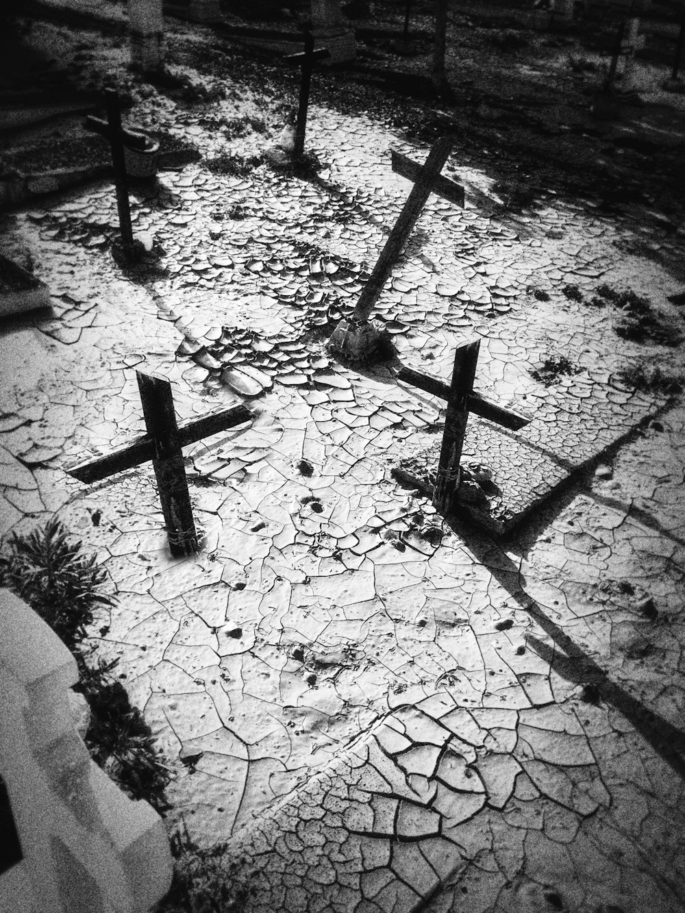gray scale photo of cross on soil