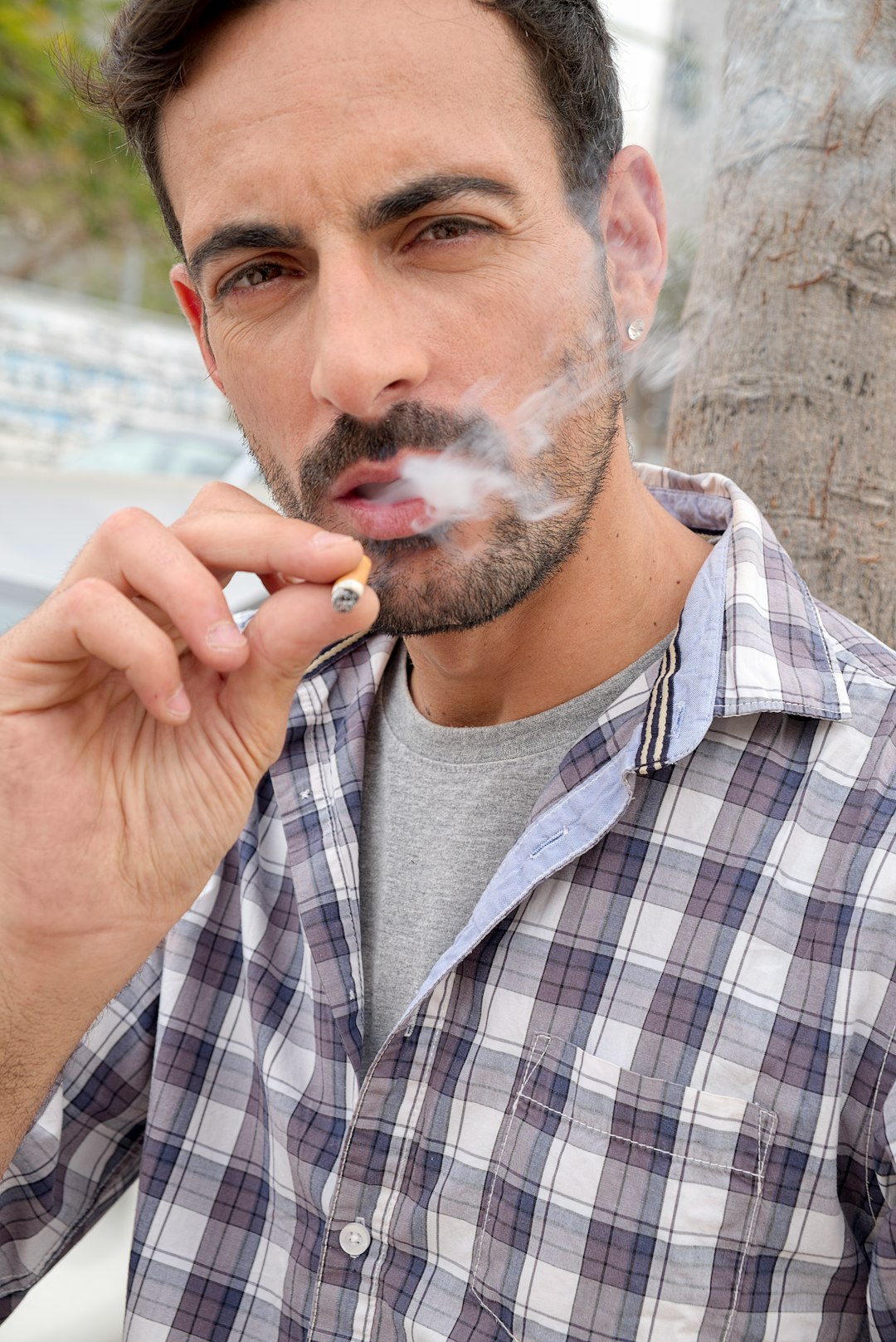 man smoking during daytime