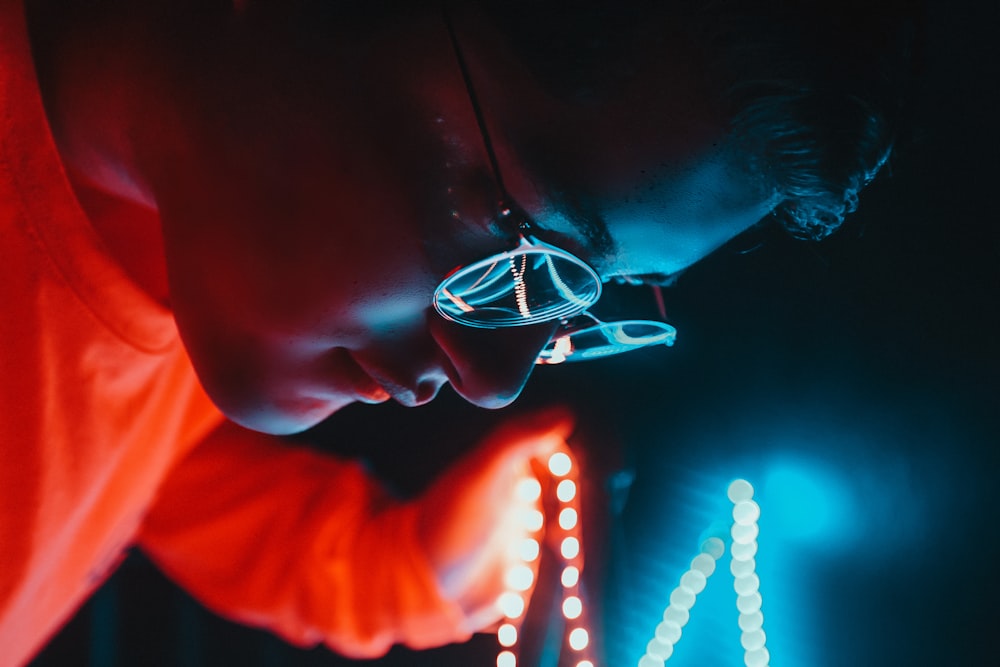 person looking at neon signage