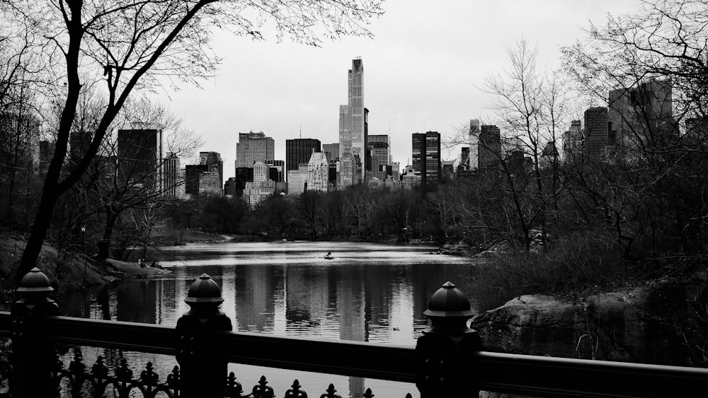 grayscale photo of buildings near ocean during daytime