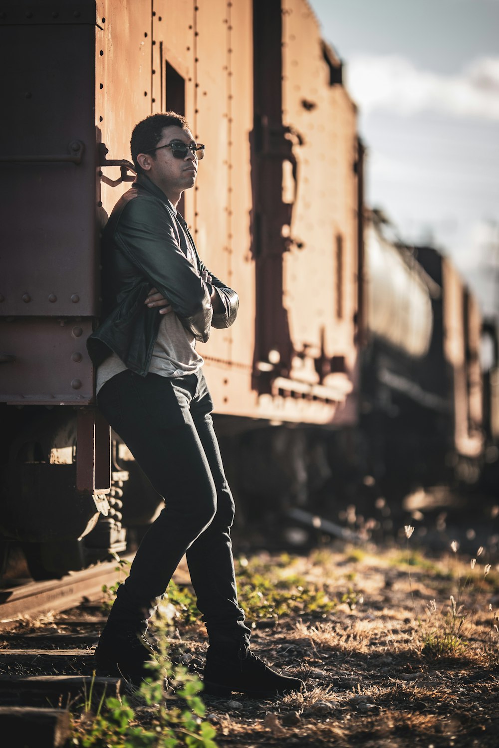 man standing beside train
