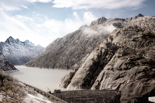 brown water dam photo in Grimselpass Switzerland