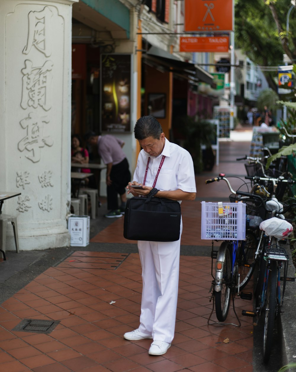 man carring black bag