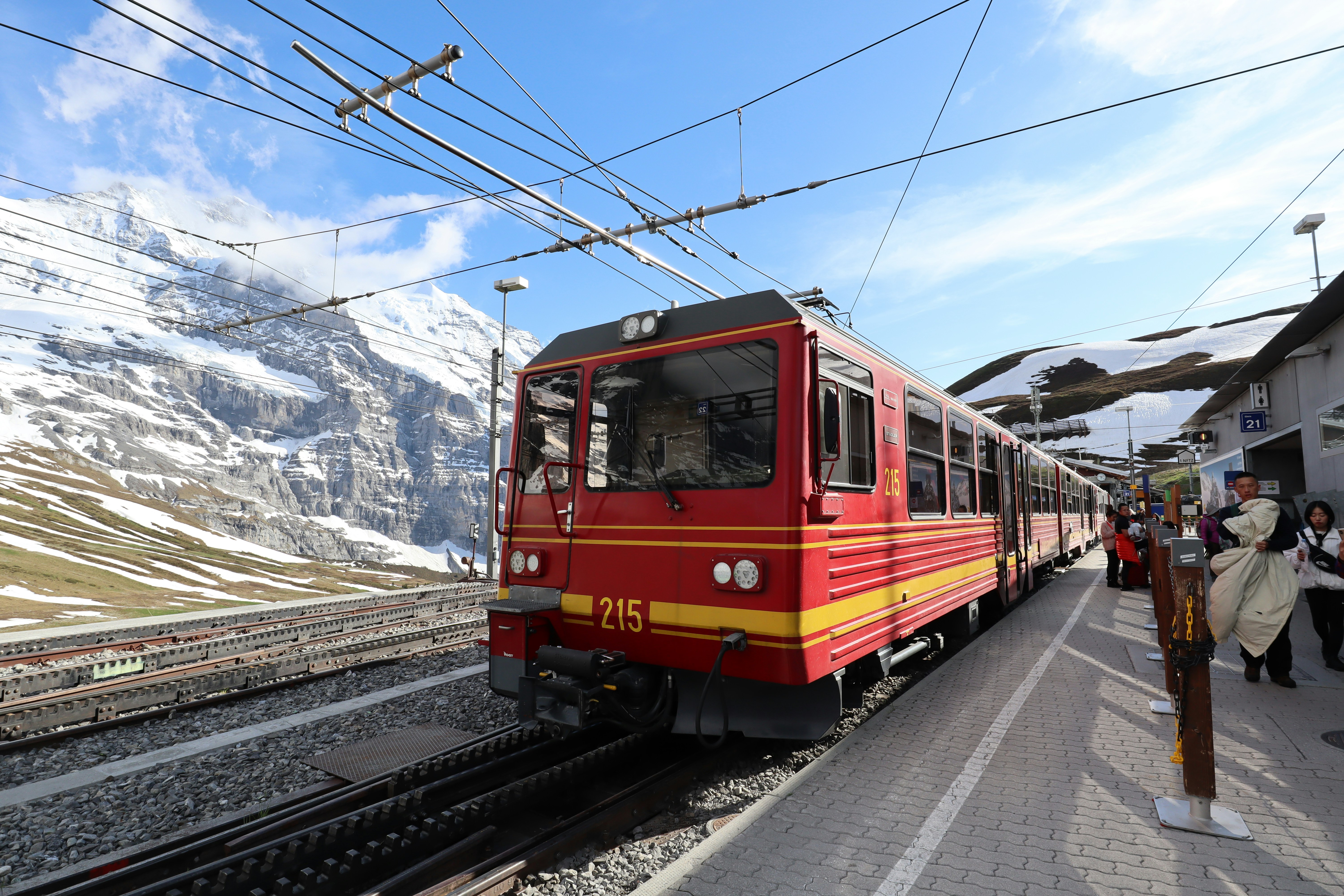 time lapse photography of red and black train during daytime