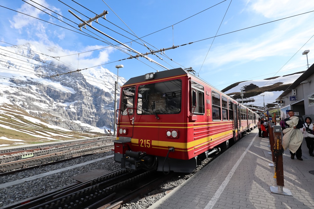 time lapse photography of red and black train during daytime