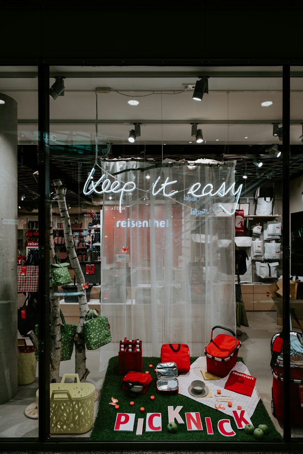 red bags and basket on display