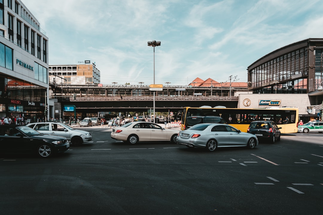 cars passing near building during daytime