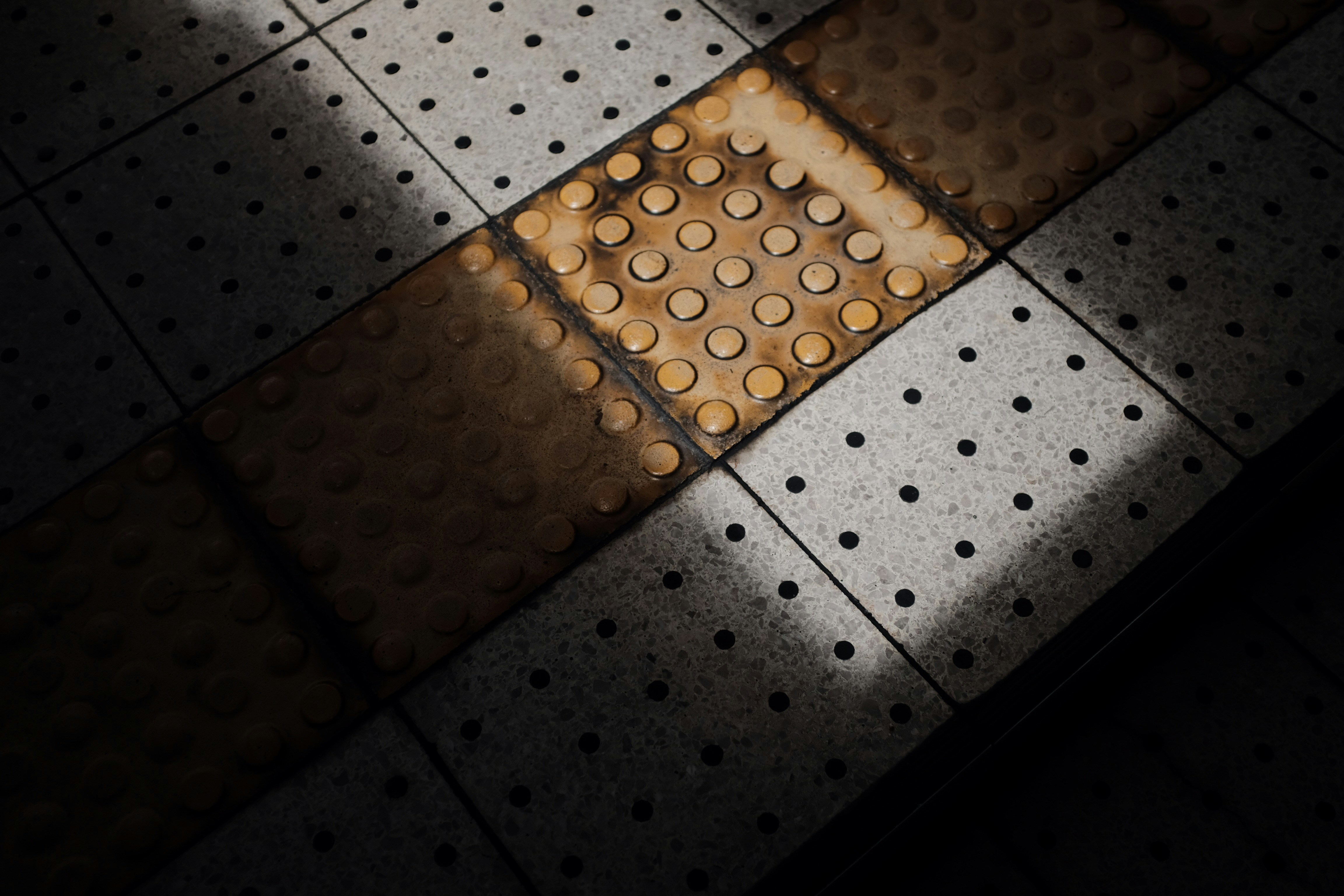 a tiled floor with dots on it