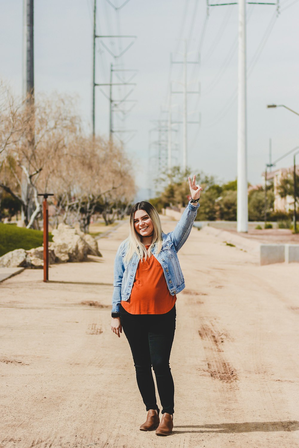 shallow focus photo of woman in blue denim button-up jacket