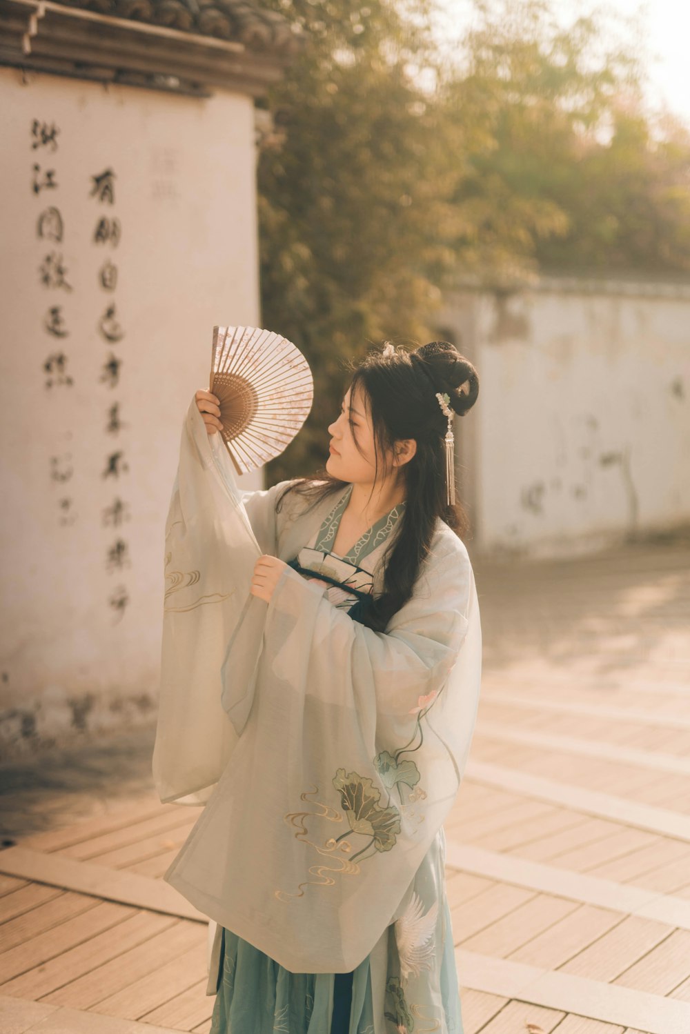 woman holding fan