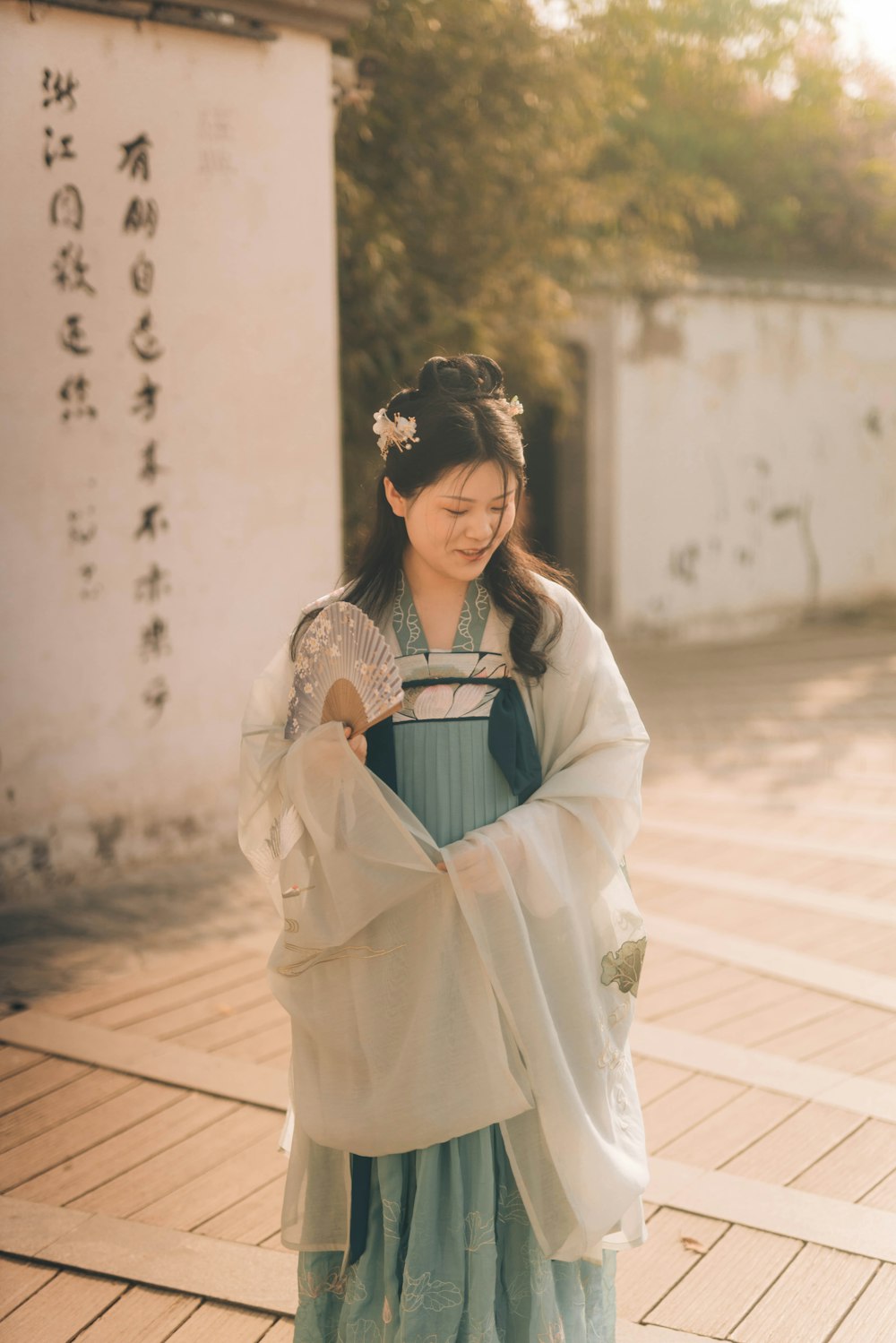 woman in white and green dress