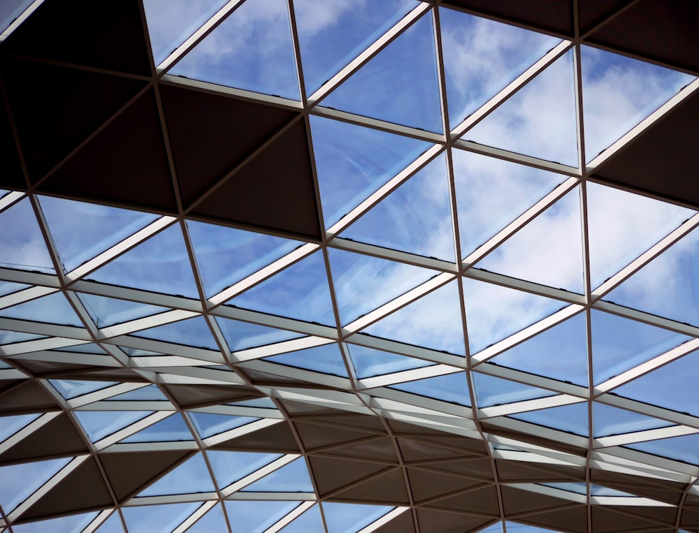 a glass ceiling with a sky background