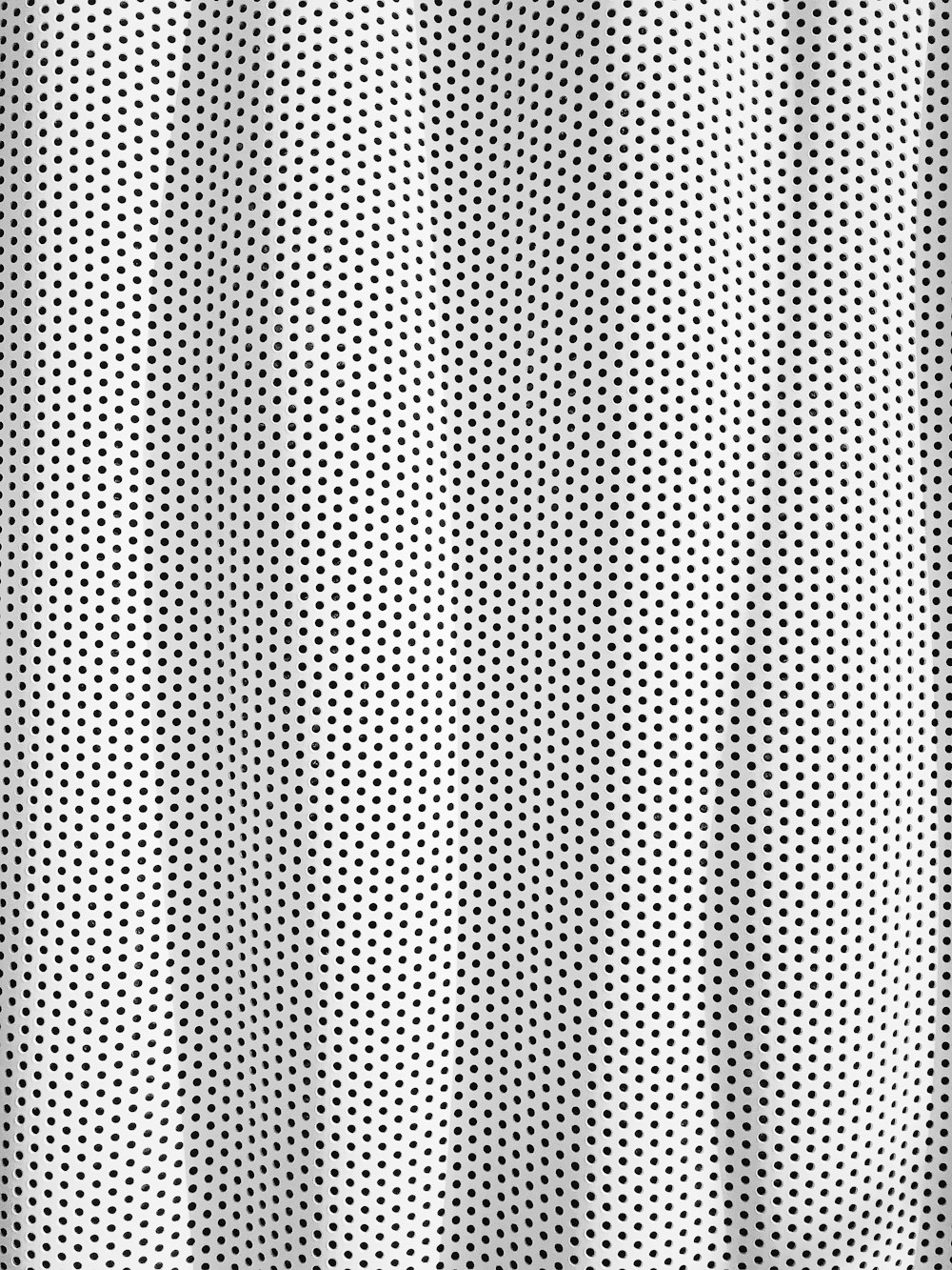 white and black polka dot textile