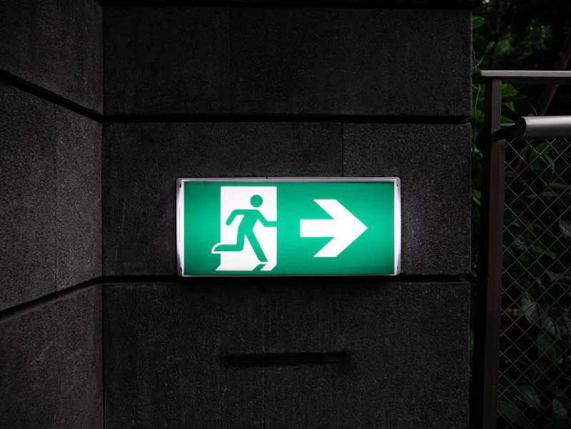 Emergency lighting — illuminated exit sign in darkness