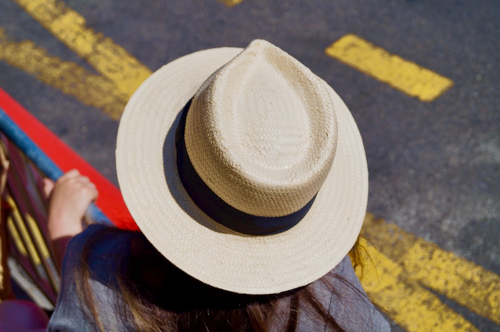 woman wearing beige hat