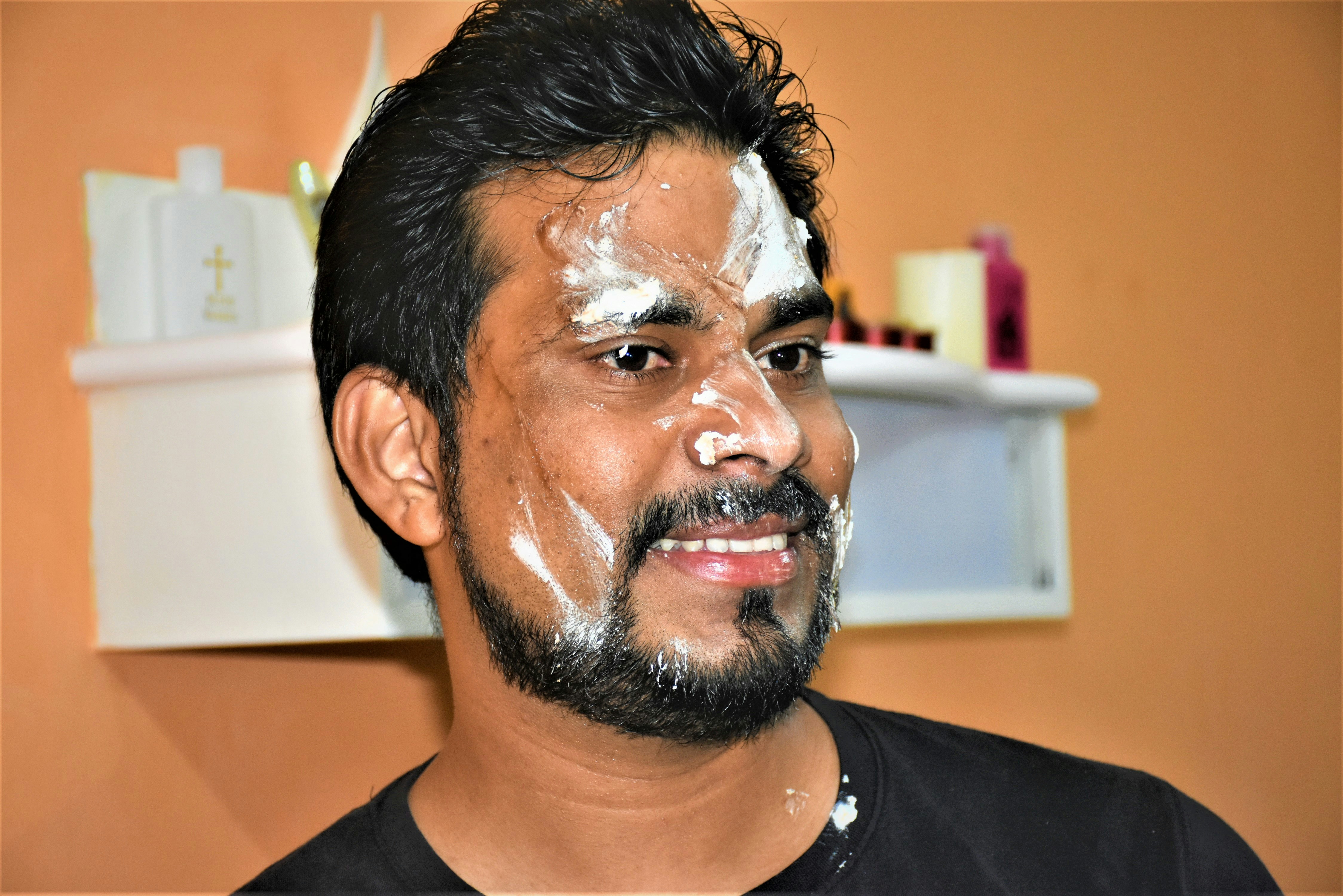 man with cream on face