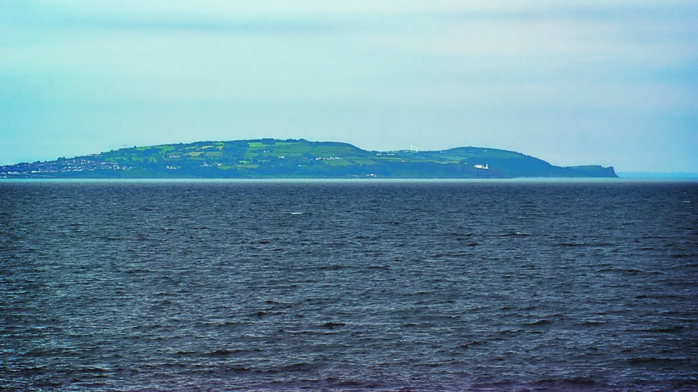 green grassy island across sea