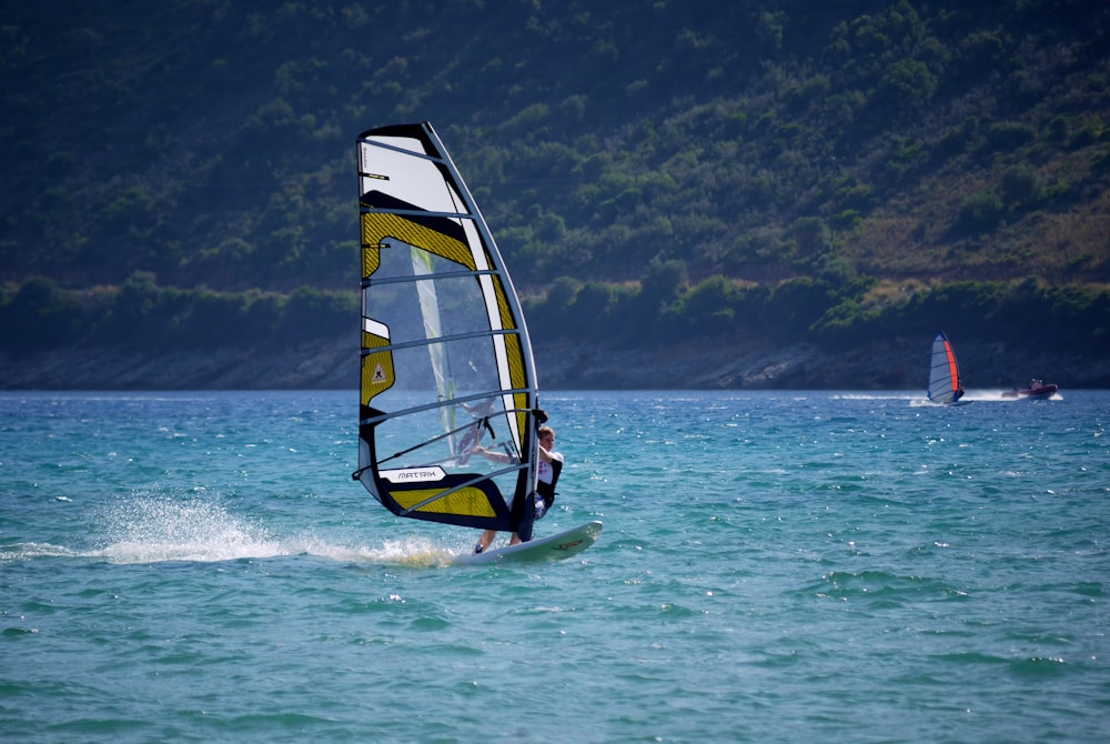 brown and white sailing boat during daytime