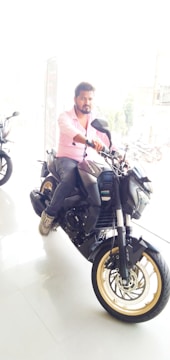 Customer discussing motorcycle financing options with a friendly staff member