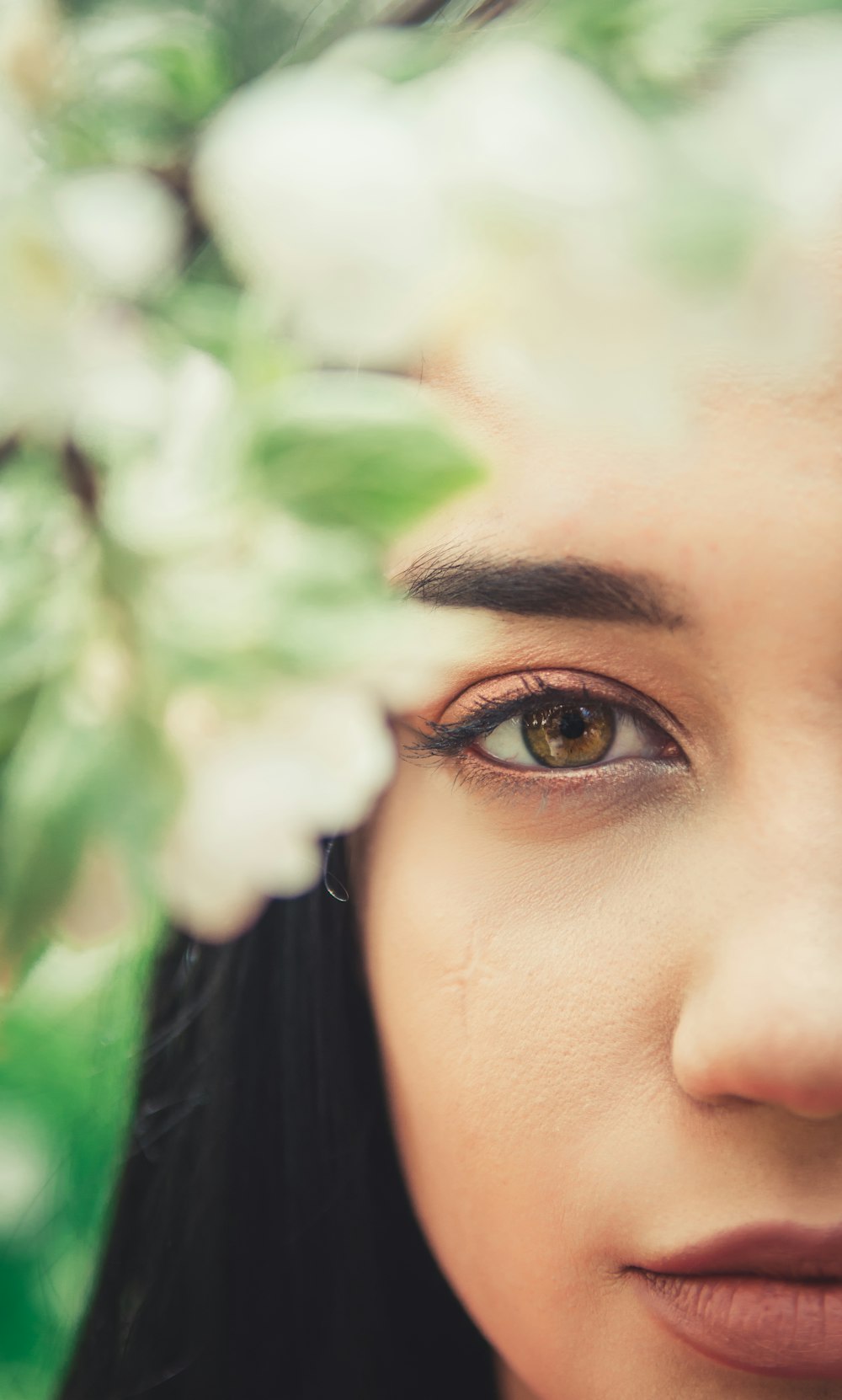 selective focus photography of woman's face