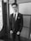 grayscale photography of man wearing eyeglasses