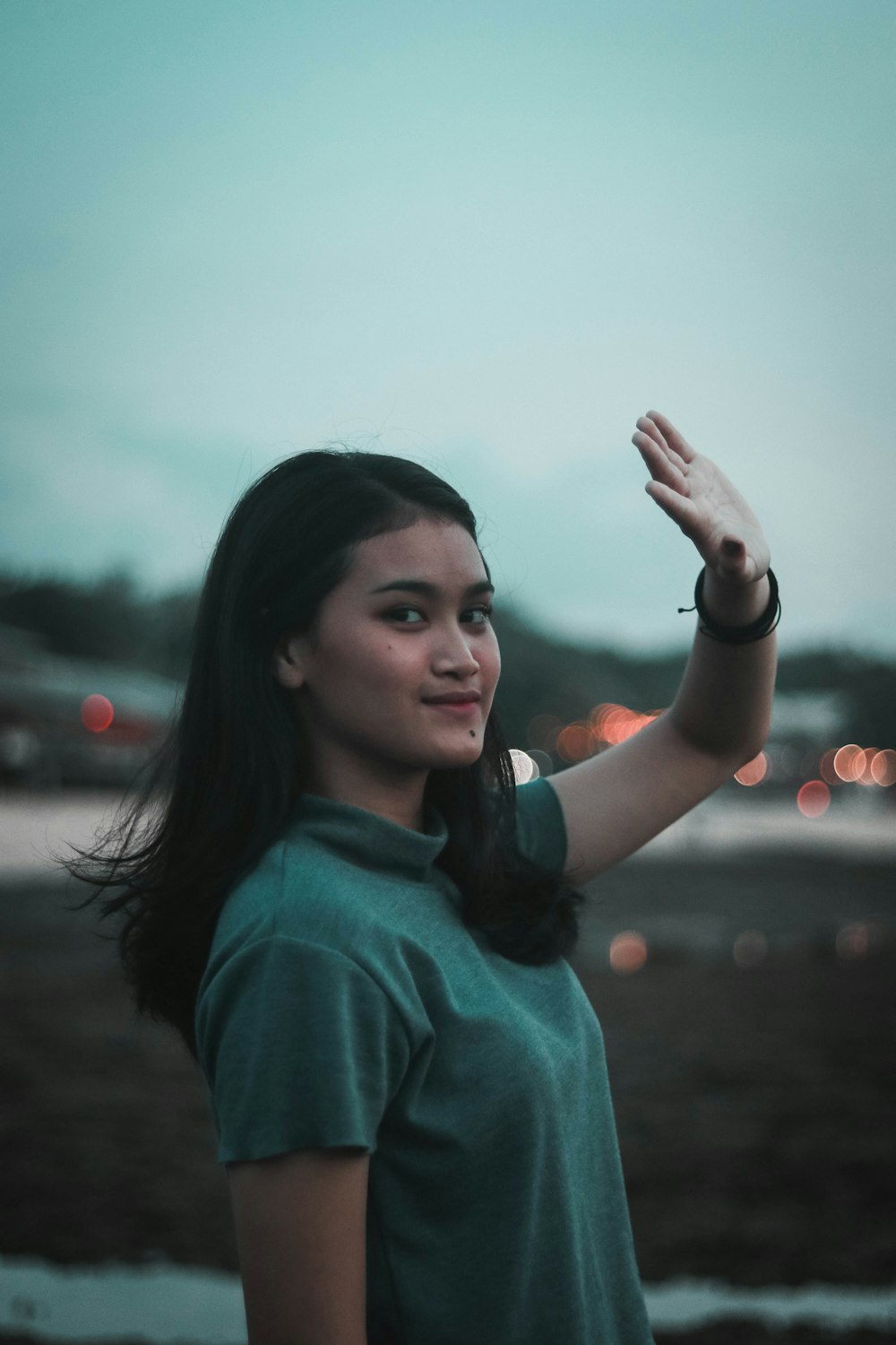 woman in green turtleneck shirt