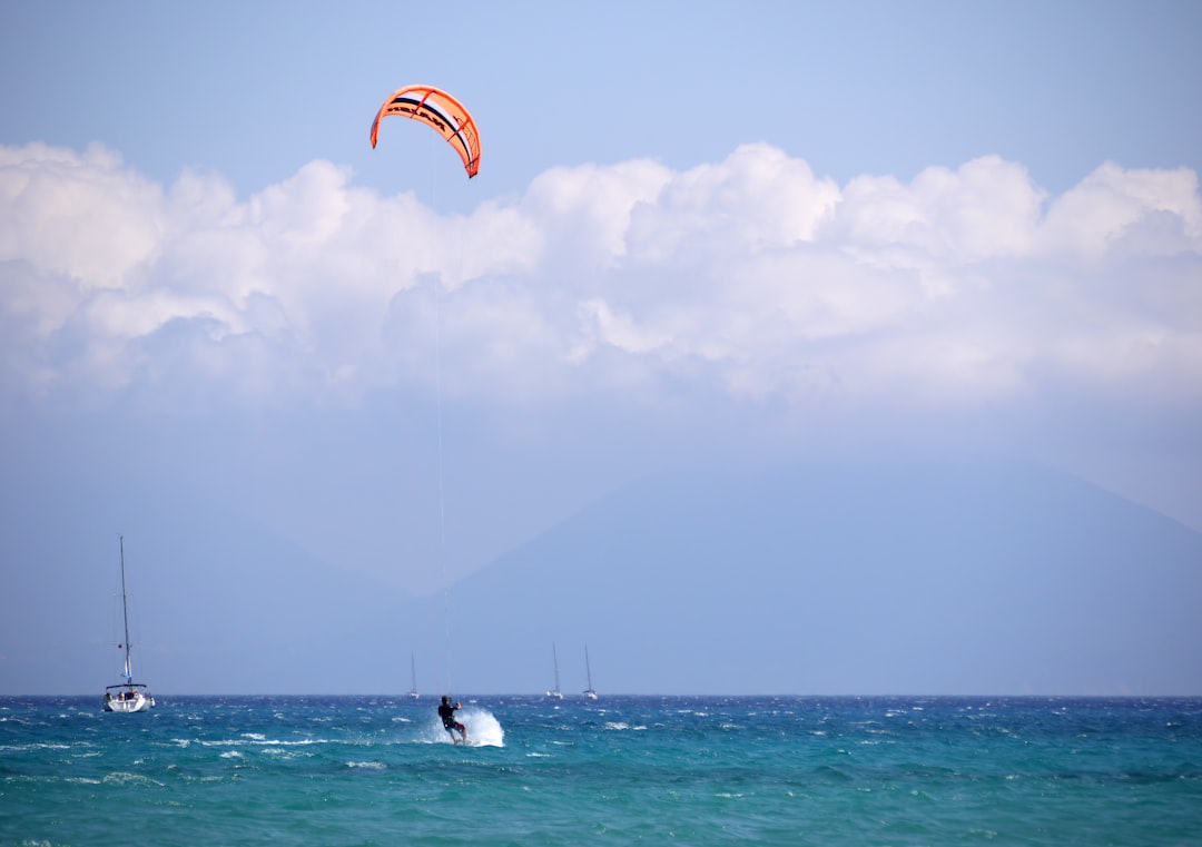 person parachute water skiing