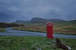 red telephone booth near road