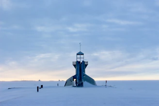 tower on snow covered field