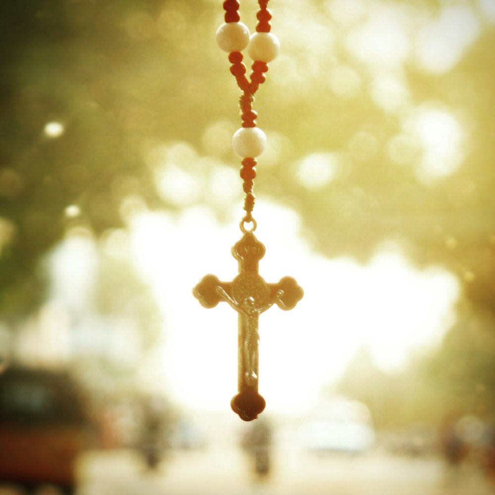 selective focus photography of rosary