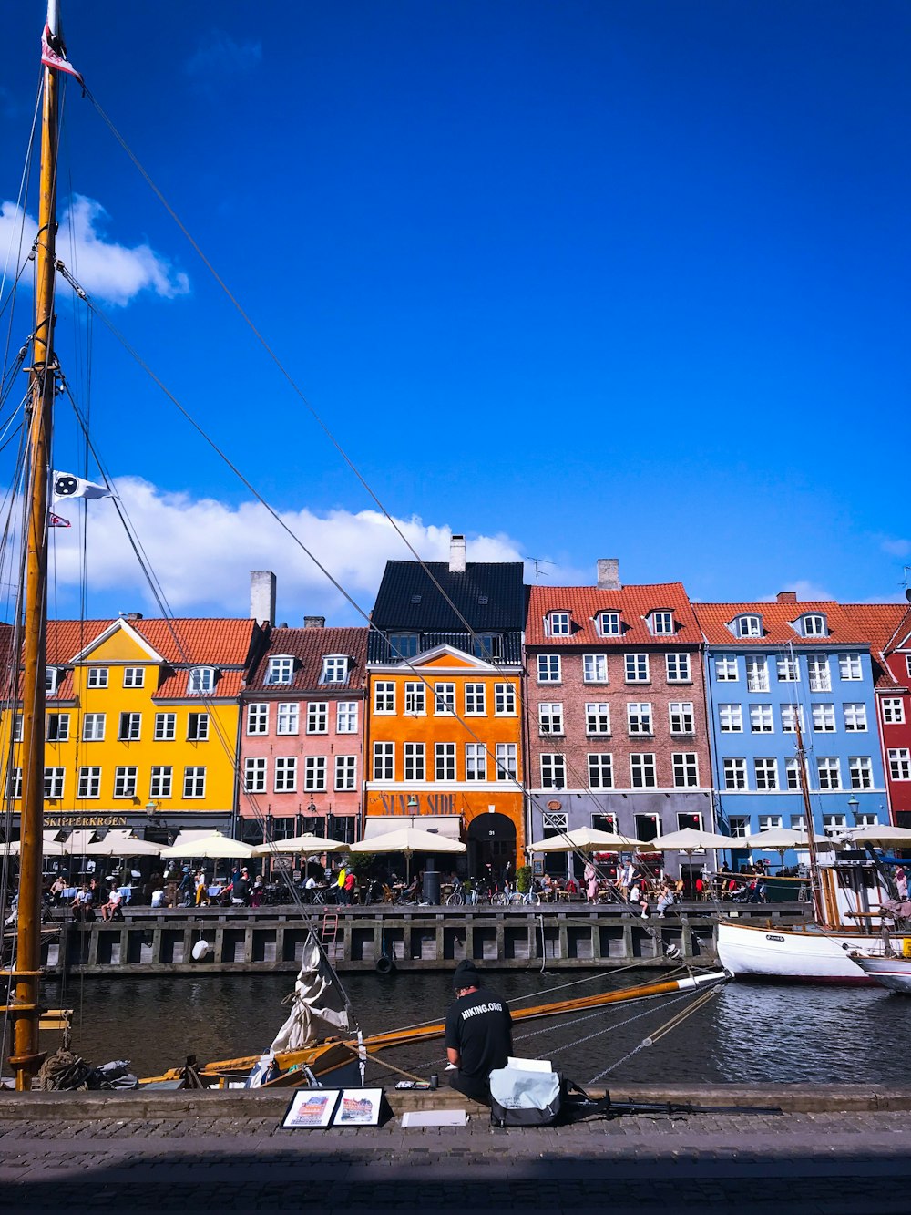 colorful in-line buildings beside canal