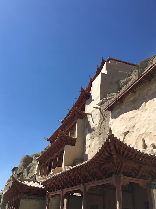 white concrete structure in Mogao Caves China