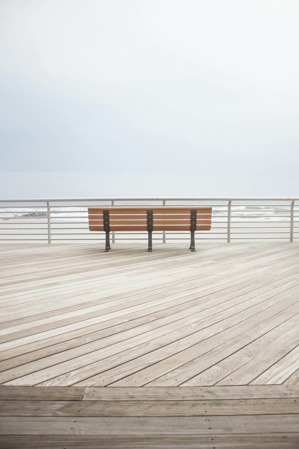 brown wooden bench at the dock