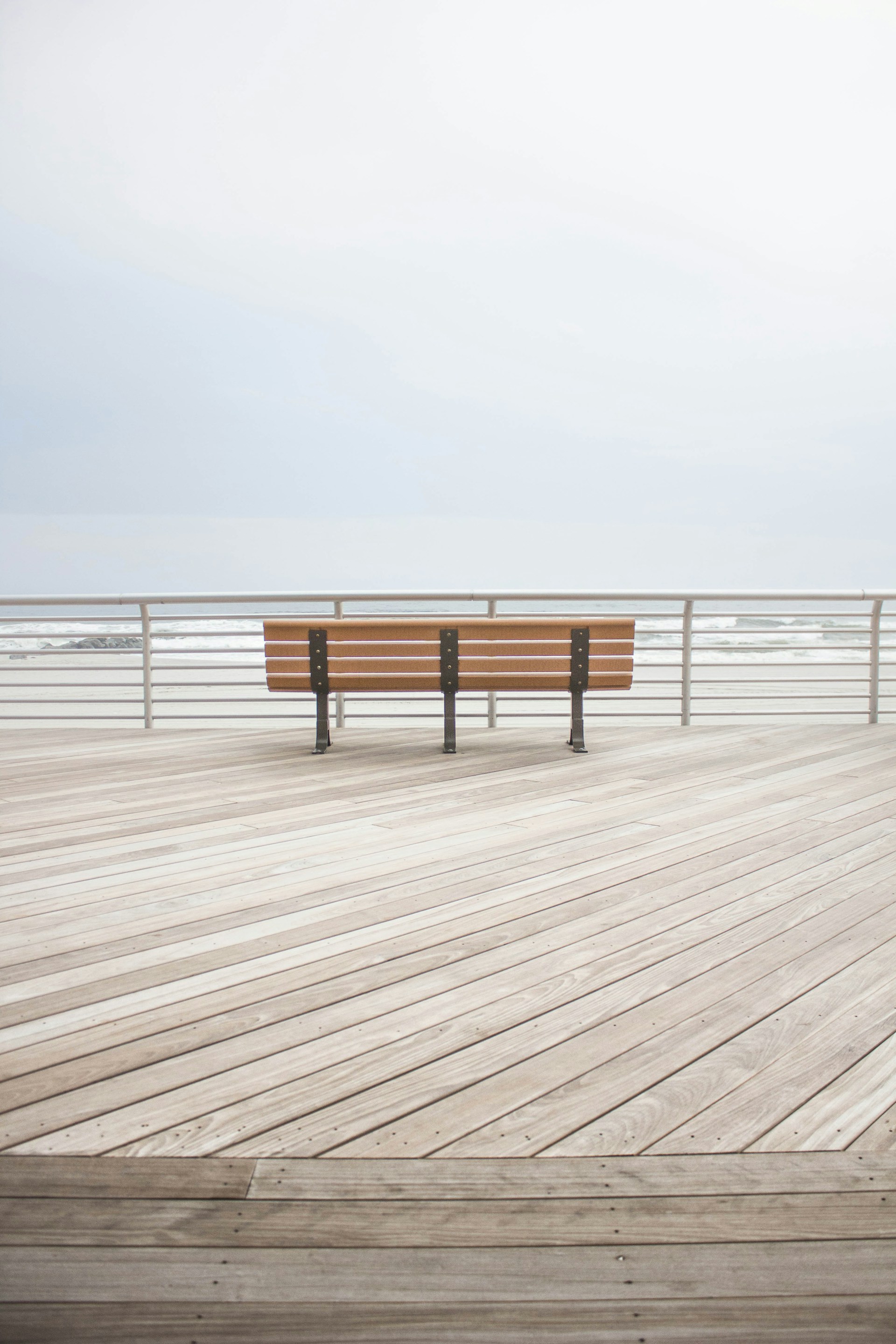 brown wooden bench at the dock