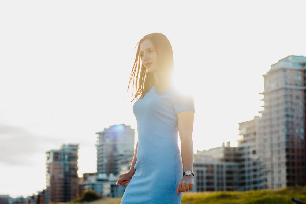 woman standing near building