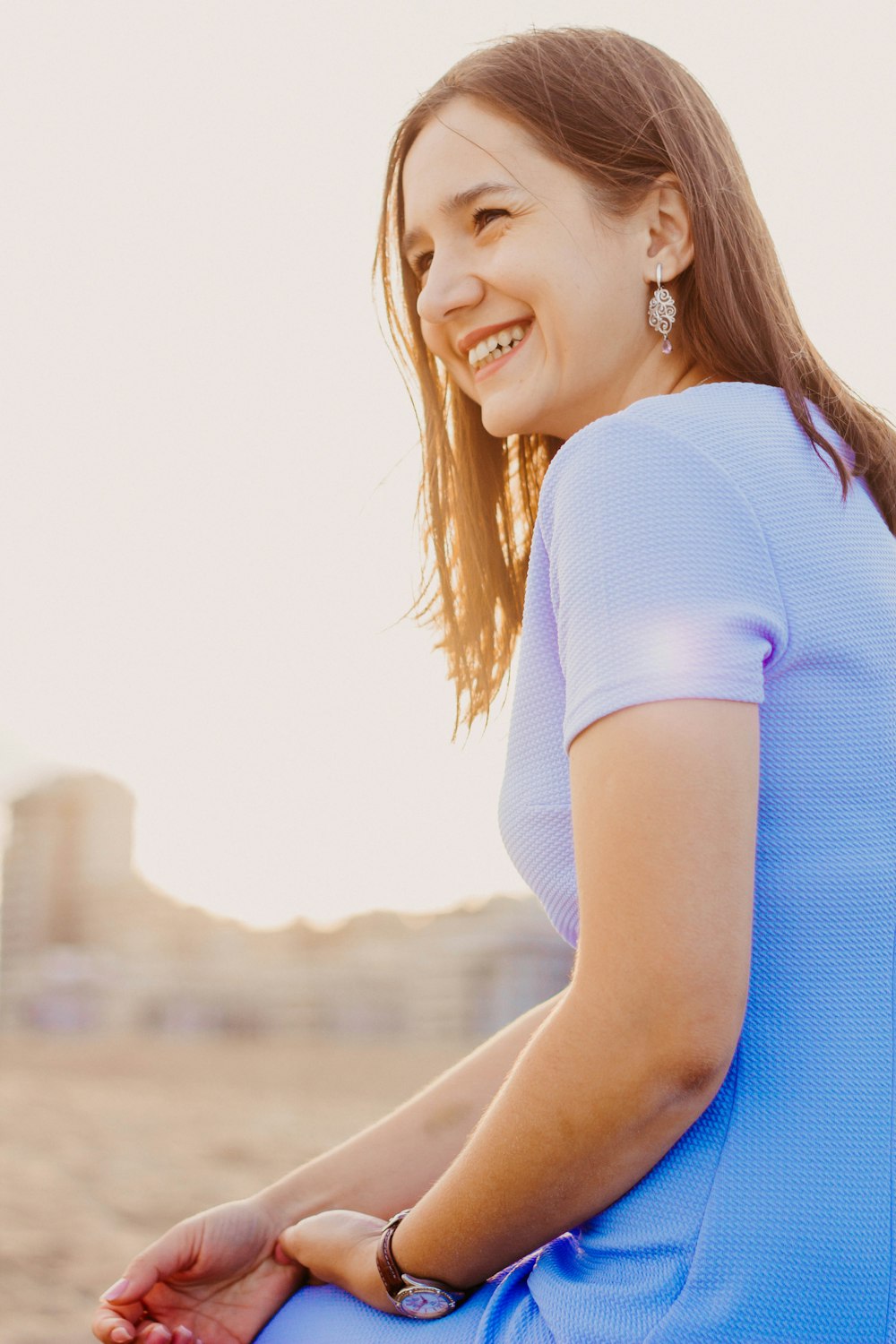 shallow focus photo of woman in blue dress