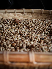 coffee beans on brown woven basket