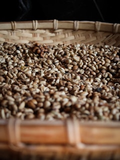 coffee beans on brown woven basket