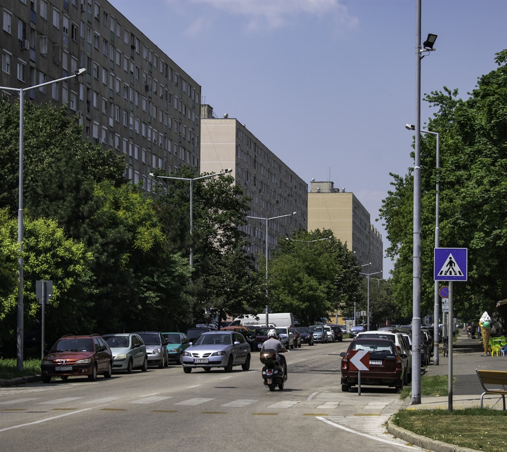 vehicles on road beside building