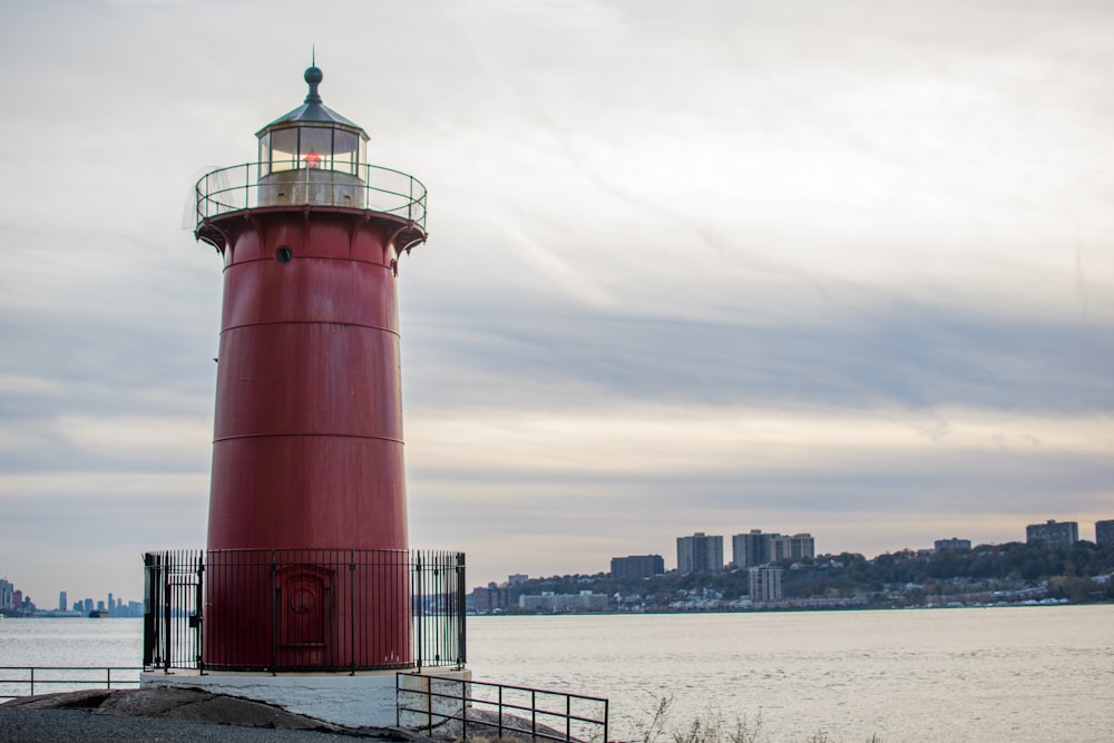 red and white lighthouse during daytime