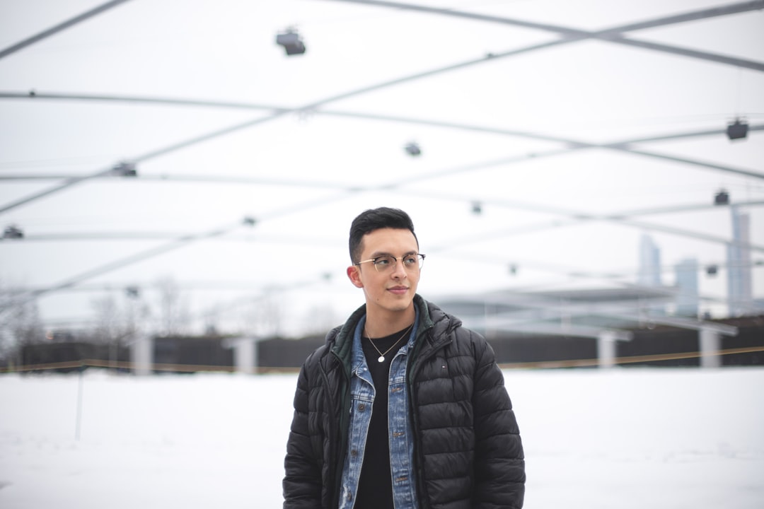 selective focus photography of man in bubble jacket