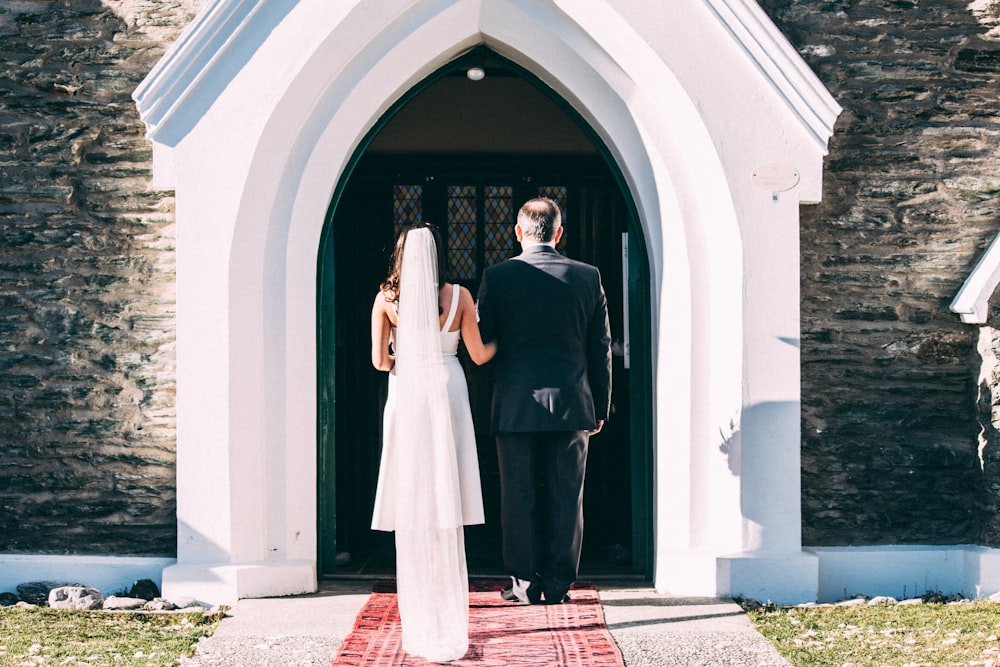 couple standing near closed door