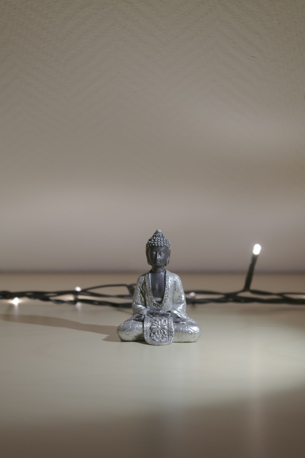 gray buddha figurine]