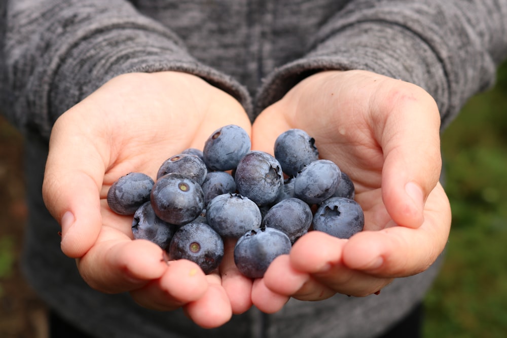 grapes on person's palm