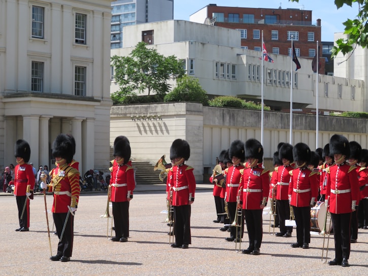 A group of Grenadier Guards avatars standing proudly in formation inside the Roblox game environment.
