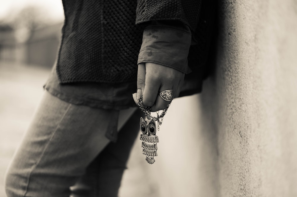 person holding jewelry