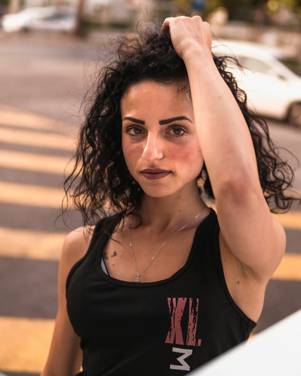 women wearing a black tank top close-up photography