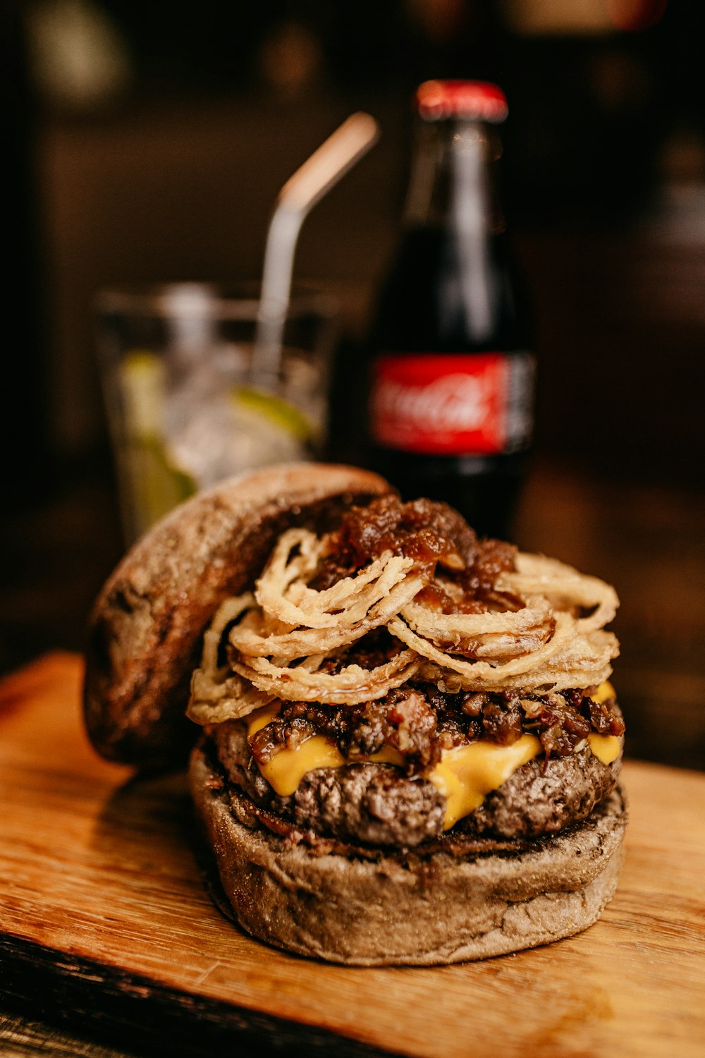 burger in brown wooden board