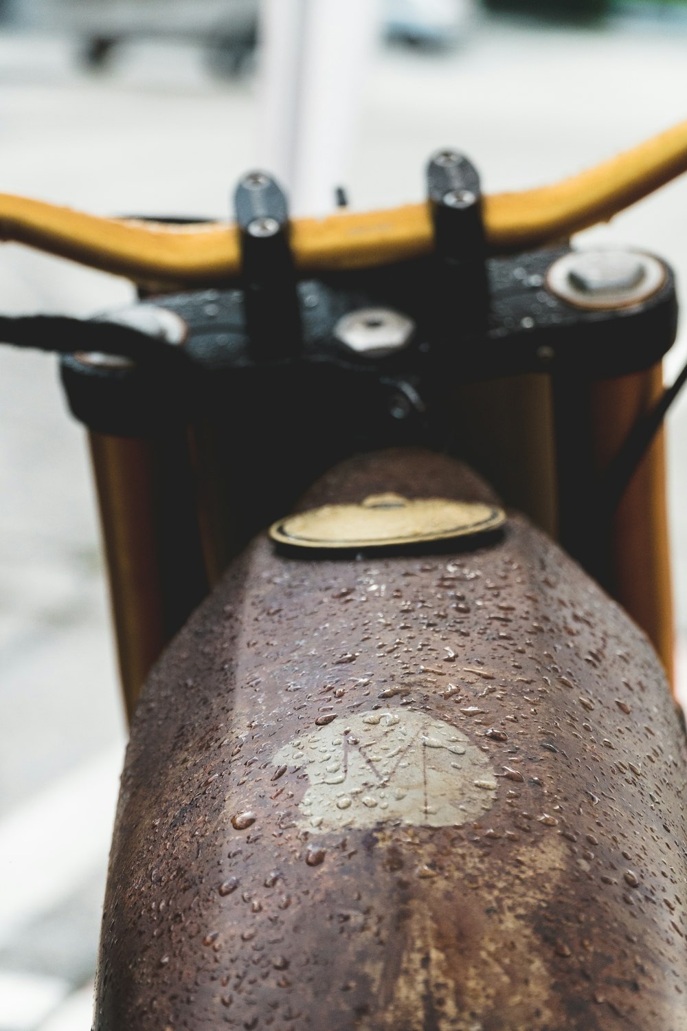 brown motorcycle on selective focus photography